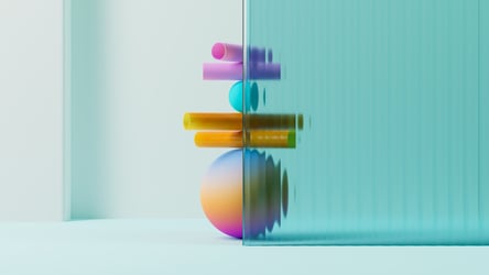 Multicolored shapes stacked and partially shown behind ribbed glass. 