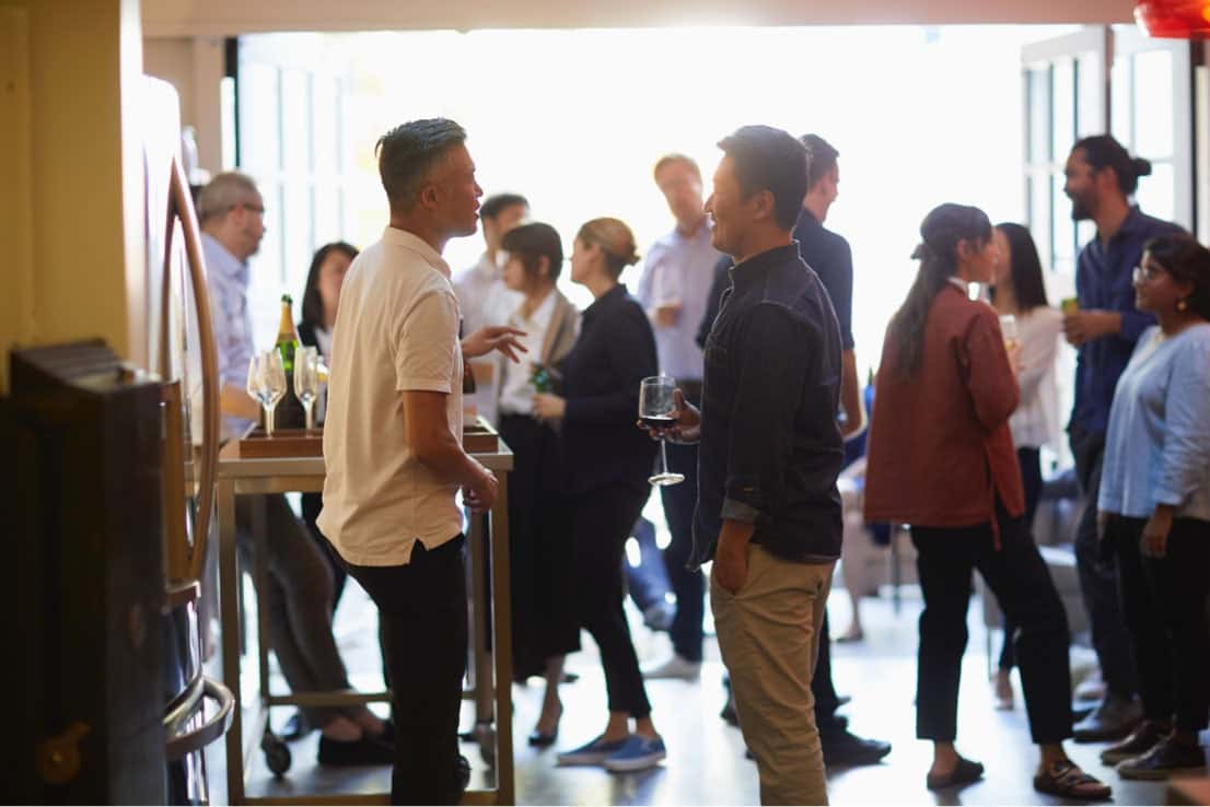 two men chatting at networking event