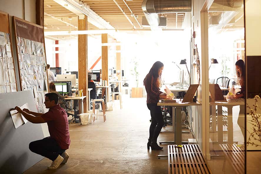 far away photo of employees in open space office